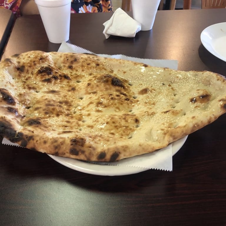 Freshly Baked Naan: A Flavorful Addition