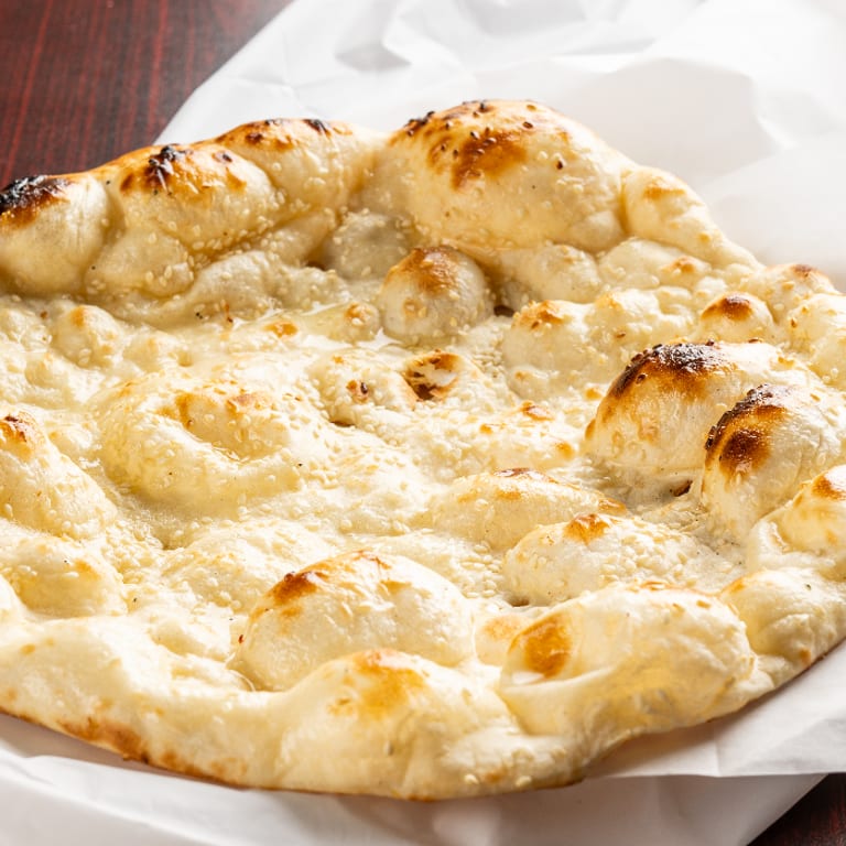 Freshly Baked Naan: A Flavorful Addition